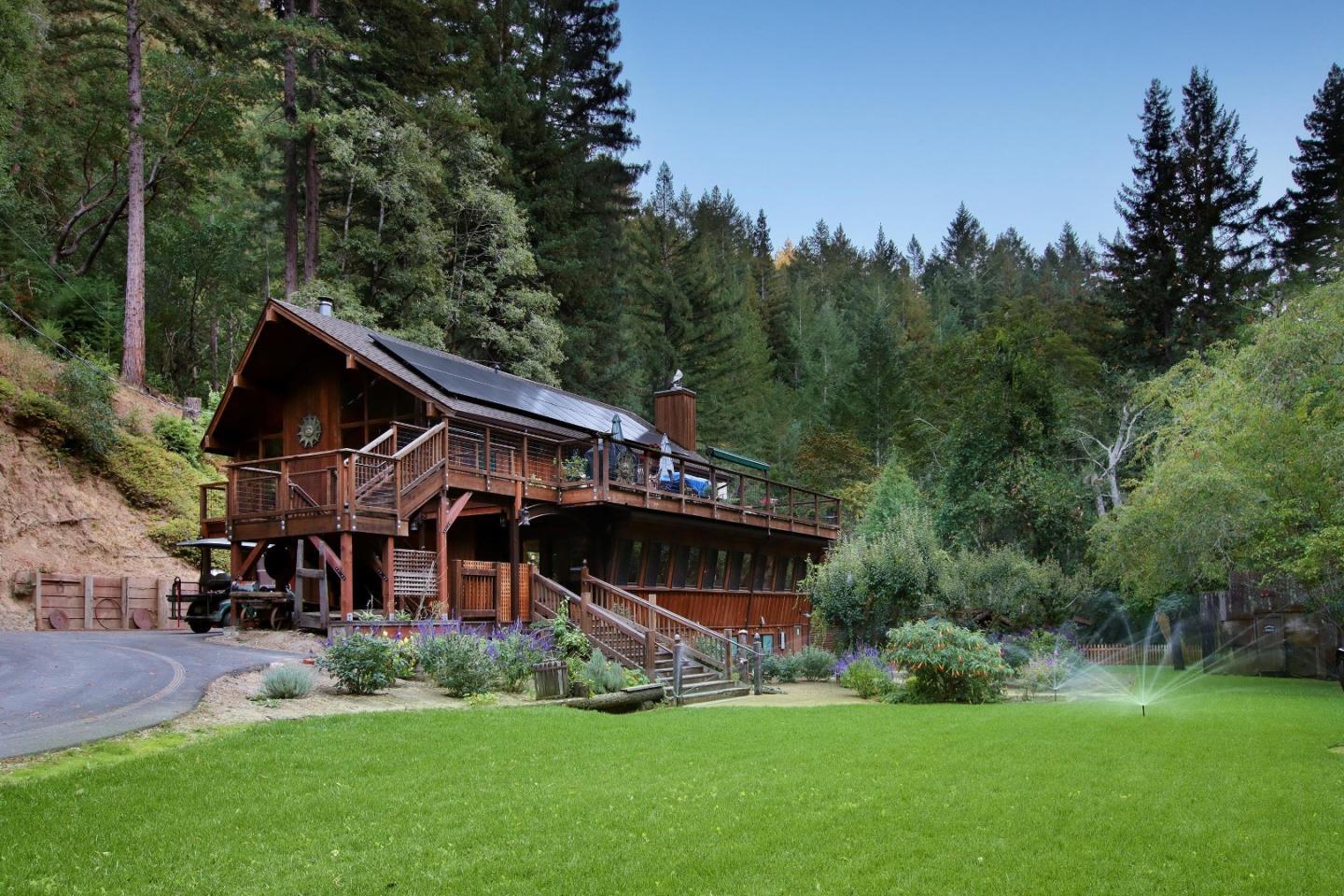 Laurel Mill Lodge overlooking its lawn, framed by redwoods.